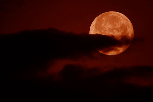 Pac Man Moon Swallows Clouds (Orange Shade Photo)