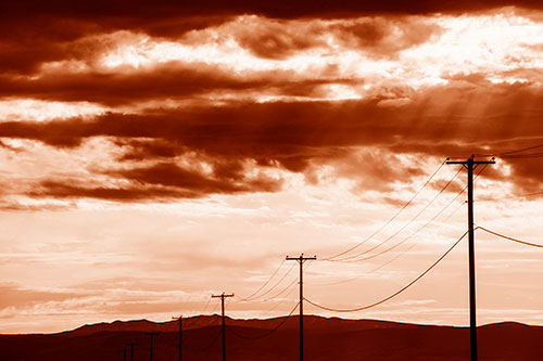 Powerline Silhouette Entering Mountain Range (Orange Shade Photo)