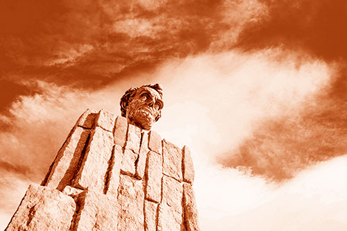 Presidents Statue Standing Tall Among Clouds (Orange Shade Photo)