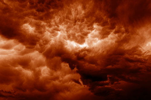 Raging Thunderstorm Clouds Brewing Among Sky (Orange Shade)