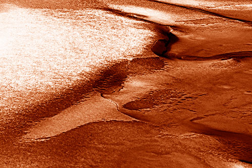 Sloping Ice Melting Atop River Water (Orange Shade Photo)