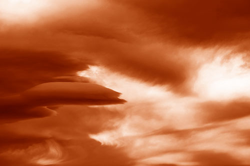 Smooth Cloud Sails Along Swirling Formations (Orange Shade Photo)