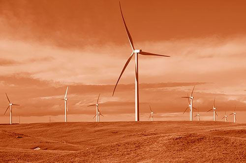 Wind Turbine Cluster Scattered Across Land (Orange Shade Photo)