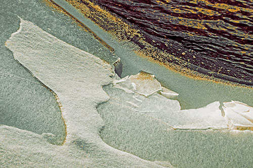 Broken Cracked Ice Along Shoreline (Orange Tint)