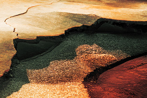 Cracked Ice Frozen Shoreline Melting (Orange Tint Photo)