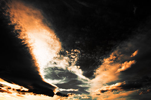 Curving Black Charred Sunset Clouds (Orange Tint Photo)