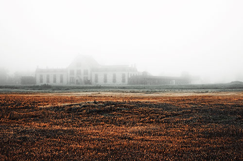 Dense Fog Consumes Distant Historic State Penitentiary (Orange Tint Photo)