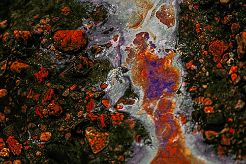 Distorted Oil Face Smearing Among Rocky Shore (Orange Tint)