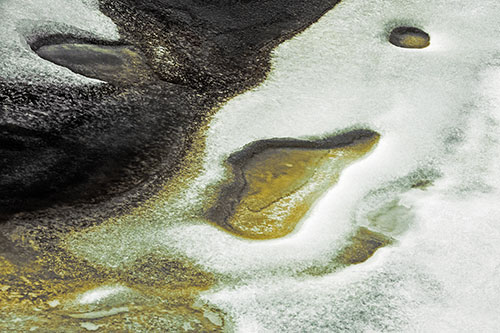 Joyful Ice Face Frozen Atop River (Orange Tint)