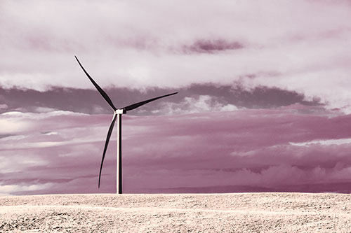 Lone Wind Turbine Standing Along Dry Prairie Horizon (Orange Tint Photo)