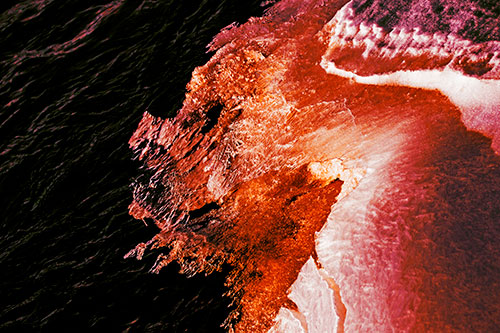 Melting Ice Face Creature Atop River Water (Orange Tint Photo)