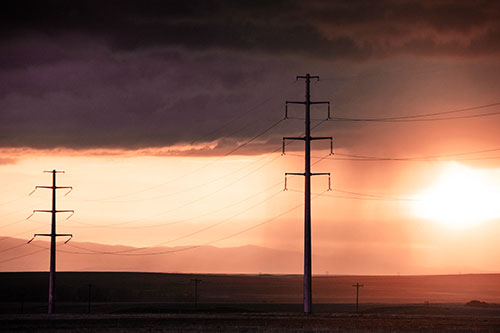 Mountain Rainstorm Sunset Beyond Powerlines (Orange Tint Photo)