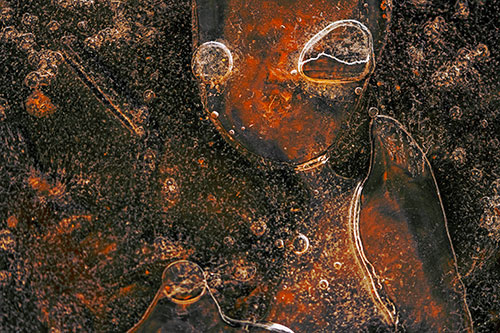 Mouthless Alien Ice Figure Forms Among Frozen River Water (Orange Tint Photo)