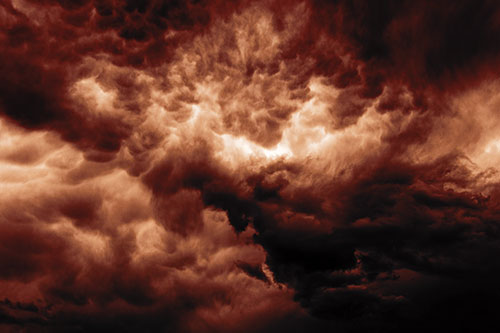 Raging Thunderstorm Clouds Brewing Among Sky (Orange Tint)