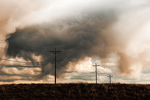 Rainstorm Clouds Twirl Beyond Powerlines (Orange Tint)