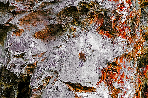 Shut Eyed Rock Face Decomposing (Orange Tint Photo)