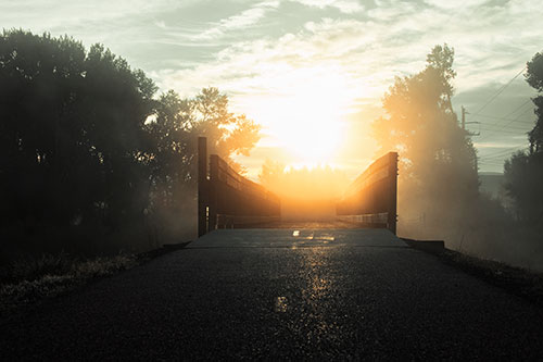 Sun Rises Beyond Foggy Wooden Walkway Bridge (Orange Tint Photo)