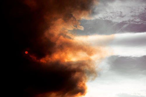 Sun Spiraling Out Of Mullen Fire Clouds (Orange Tint Photo)
