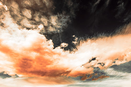Sunset Illuminating Large Cloud Mass (Orange Tint Photo)