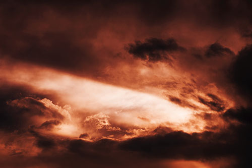 White Light Tearing Through Clouds (Orange Tint Photo)