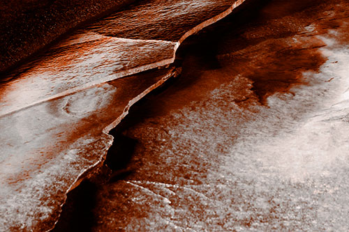 Cracking Blood Frozen Ice River (Orange Tone Photo)