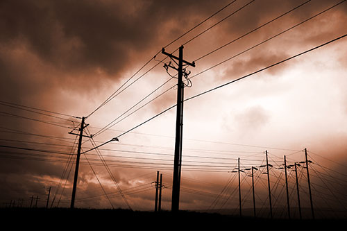 Crossing Powerlines Beneath Rainstorm (Orange Tone Photo)