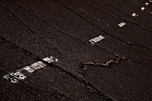 Decomposing Pavement Markings Along Sidewalk (Orange Tone Photo)