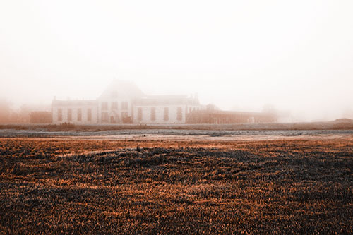 Dense Fog Consumes Distant Historic State Penitentiary (Orange Tone Photo)