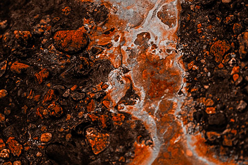 Distorted Oil Face Smearing Among Rocky Shore (Orange Tone)