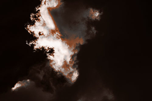 Evil Cloud Face Snarls Among Sky (Orange Tone Photo)