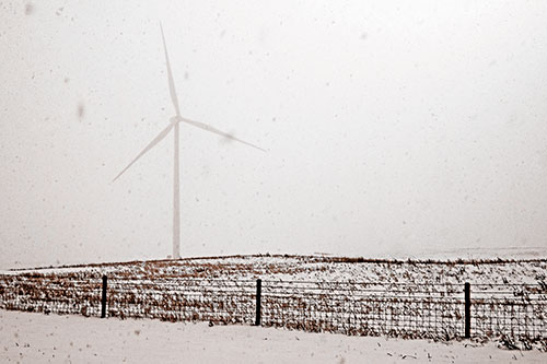 Fenced Wind Turbine Among Blowing Snow (Orange Tone)