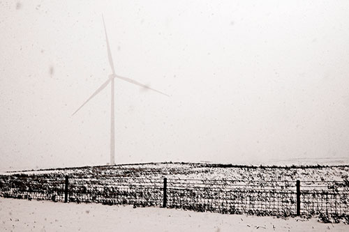 Fenced Wind Turbine Among Blowing Snow (Orange Tone Photo)