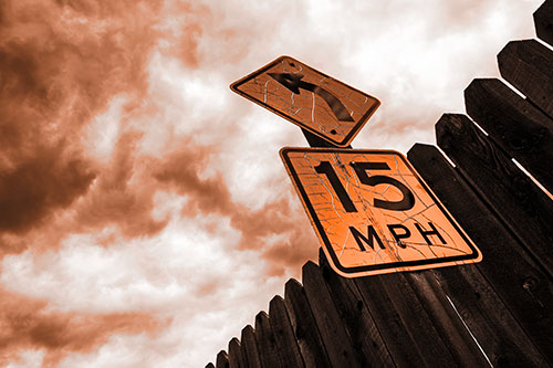 Left Turn Speed Limit Sign Beside Wooden Fence (Orange Tone Photo)