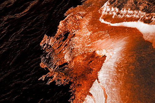 Melting Ice Face Creature Atop River Water (Orange Tone Photo)