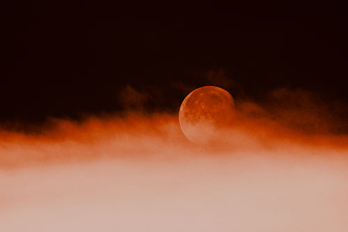 Moon Rolling Along Clouds (Orange Tone Photo)