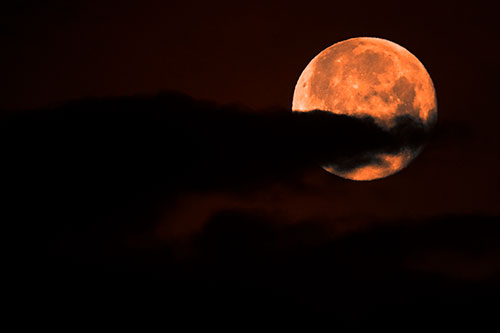 Pac Man Moon Swallows Clouds (Orange Tone Photo)