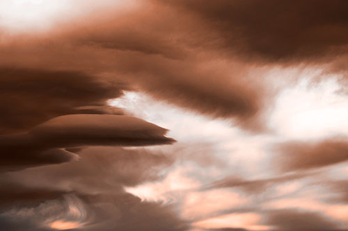 Smooth Cloud Sails Along Swirling Formations (Orange Tone Photo)