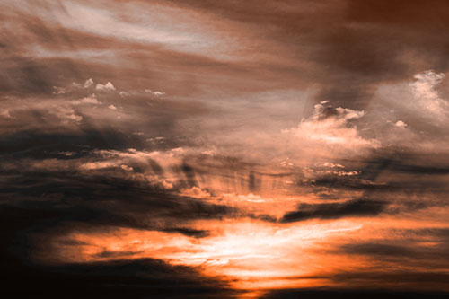 Sunrise Bursting Colorful Light Past Clouds (Orange Tone Photo)