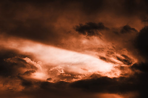 White Light Tearing Through Clouds (Orange Tone Photo)