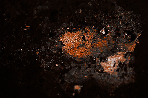 Wide Eyed Oil Demon Face Floating Atop Water (Orange Tone)