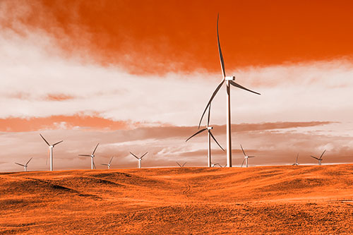 Wind Turbine Cluster Overtaking Hilly Horizon (Orange Tone Photo)