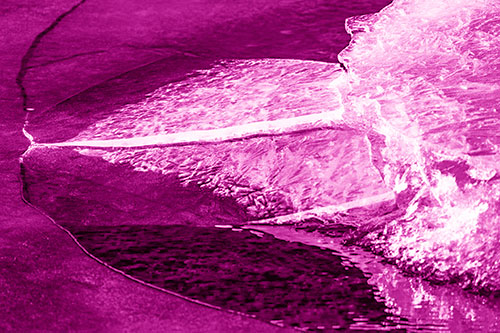 Abstract Ice Sculpture Forms Atop Frozen River (Pink Shade Photo)