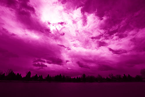 Clouds Spiraling Above Dark Lit Lake (Pink Shade Photo)