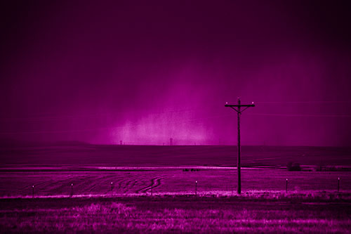 Distant Thunderstorm Rains Down Upon Powerlines (Pink Shade Photo)