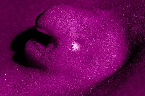 Glowing Eyed Snow Face Emerges Above Soil (Pink Shade)