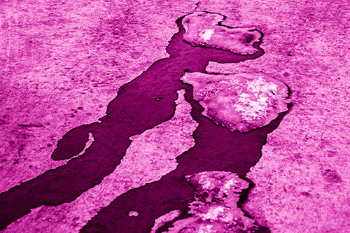 Melting Ice Puddles Forming Water Streams (Pink Shade Photo)