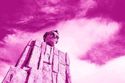 Presidents Statue Standing Tall Among Clouds (Pink Shade Photo)