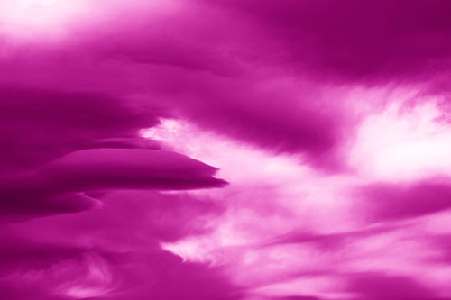 Smooth Cloud Sails Along Swirling Formations (Pink Shade Photo)