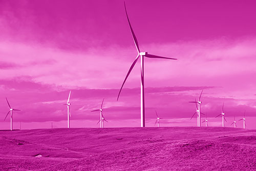 Wind Turbine Cluster Scattered Across Land (Pink Shade Photo)