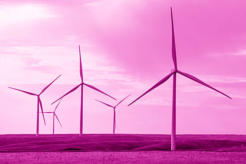 Wind Turbines Standing Tall On Green Pasture (Pink Shade Photo)